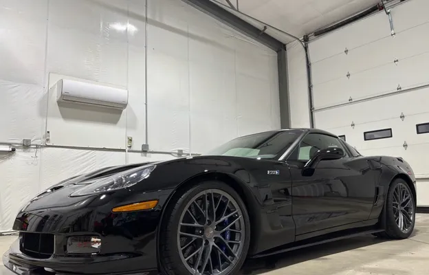 Black Chevrolet Corvette ZR1 with a deep, glossy exterior finish after detailing