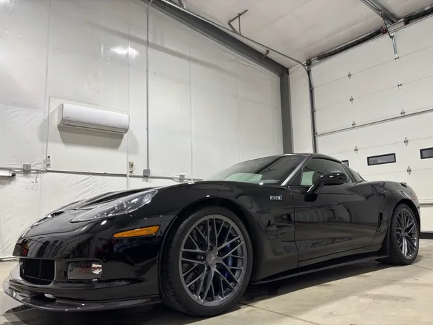 Black Chevrolet Corvette ZR1 with a deep, glossy exterior finish after detailing
