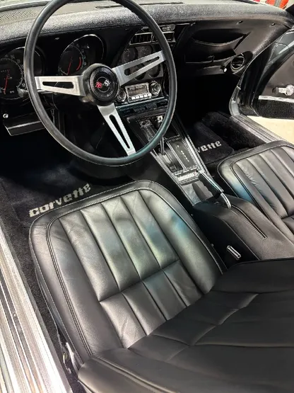 Corvette interior with clean black and gray seats and console after detailing
