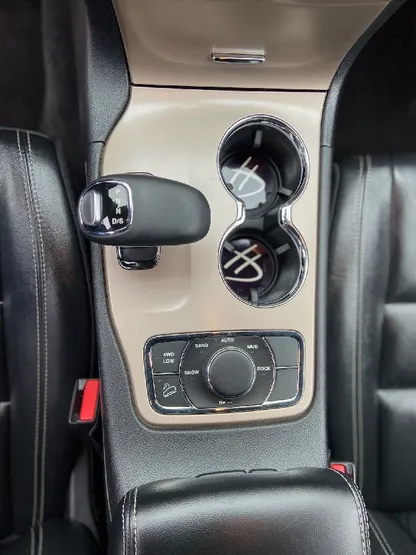 Truck interior center console and cupholders with wood trim after detailing