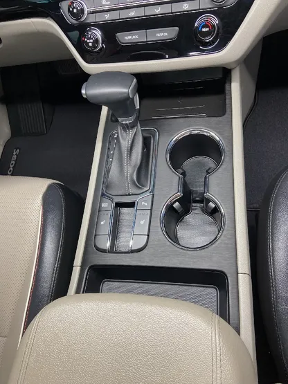 Sedan interior center console and cupholders after detailing