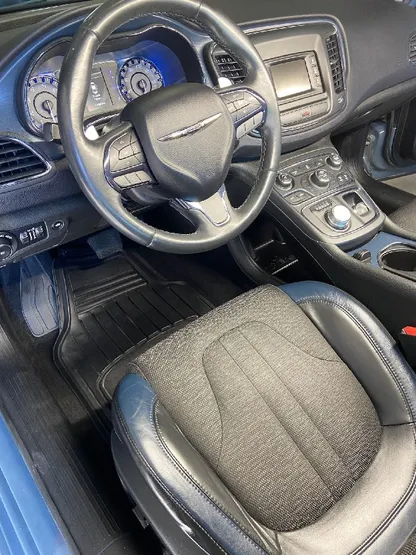 Blue Chrysler 200 interior with clean black and gray leather after detailing