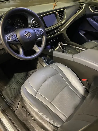 Buick SUV interior with clean gray leather seats after detailing