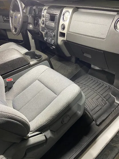 Ford F-150 interior with clean gray cloth seats after detailing