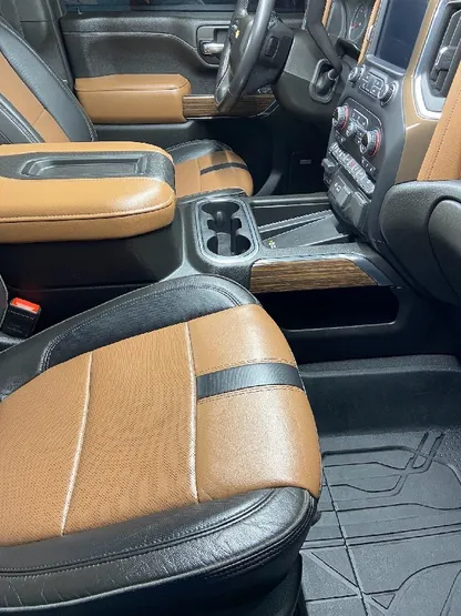 Truck interior with clean two-tone leather seats after detailing