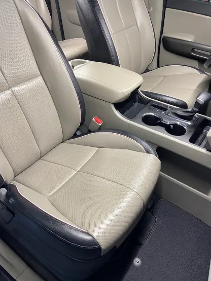 SUV interior with clean tan leather seats after detailing