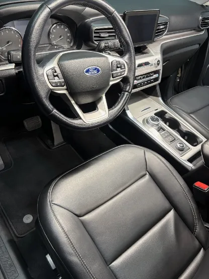 Ford Explorer interior with clean black leather seats after detailing