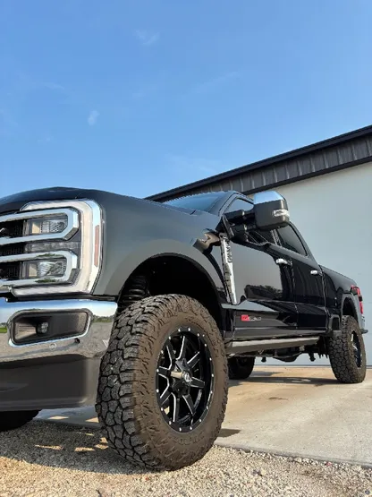 Black lifted Ford Super Duty truck after exterior detailing