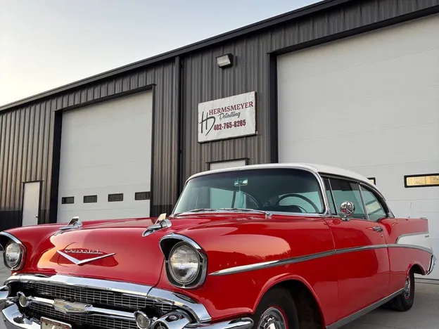 Classic red Chevrolet detailed by Hermsmeyer Detailing parked outside the shop in Central City, NE
