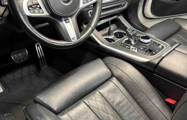 Clean black leather BMW interior and steering wheel after interior detailing