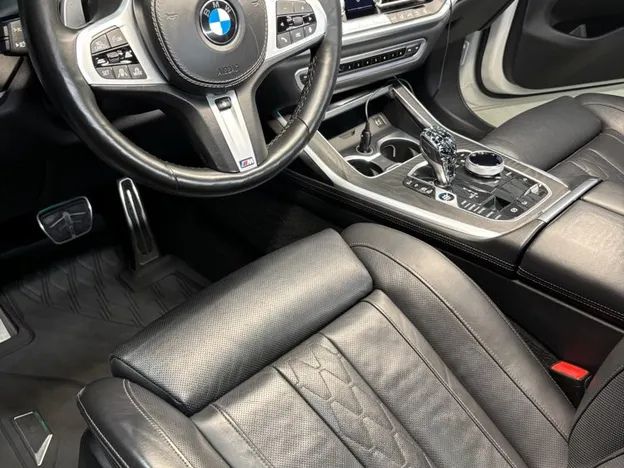 Clean black leather BMW interior and steering wheel after interior detailing